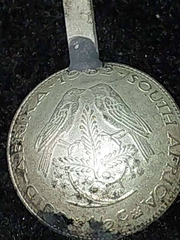 A VINTAGE SET OF BIG FIVE SOUTH AFRICAN HALF-CENT COIN SPOONS