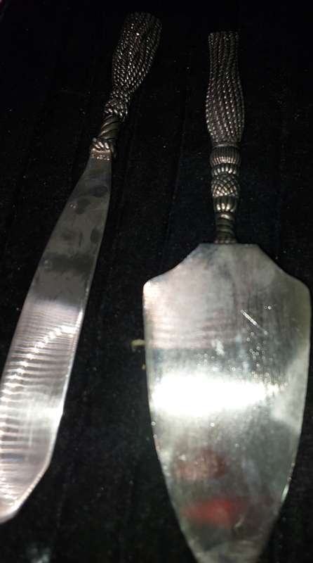 A VINTAGE SET CARVING KNIFE AND A CAKE CUTTER STAINLESS STEEL
