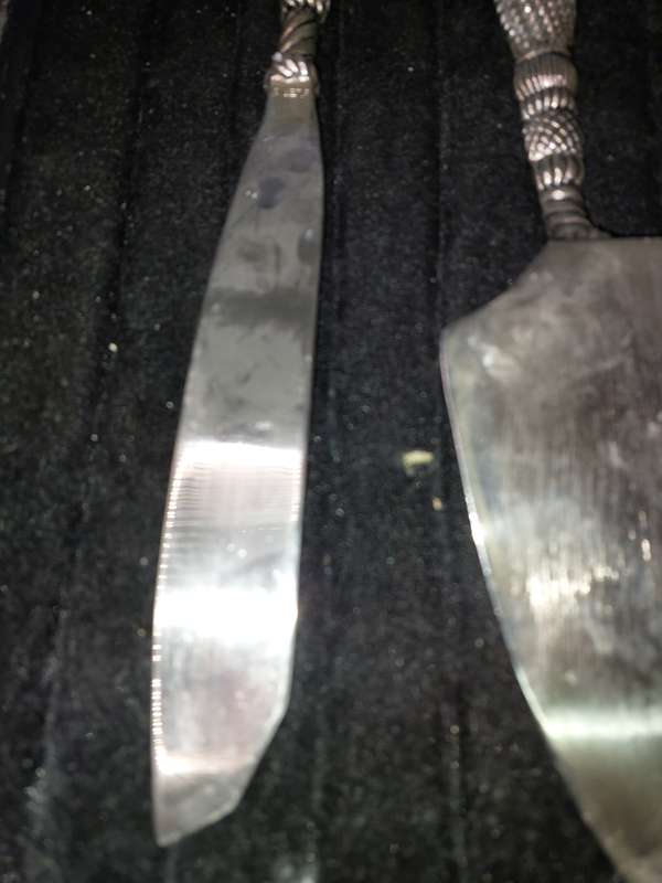 A VINTAGE SET CARVING KNIFE AND A CAKE CUTTER STAINLESS STEEL