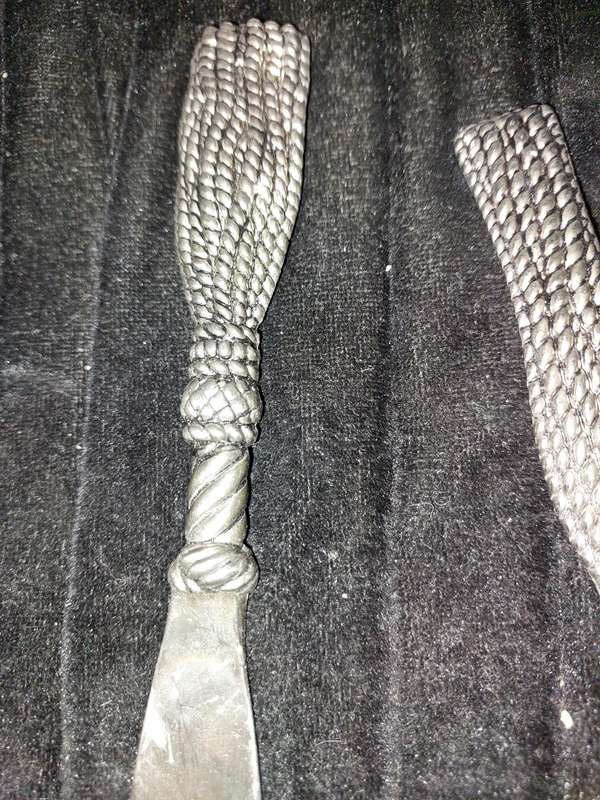 A VINTAGE SET CARVING KNIFE AND A CAKE CUTTER STAINLESS STEEL
