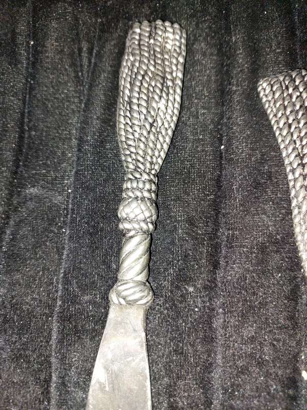 A VINTAGE SET CARVING KNIFE AND A CAKE CUTTER STAINLESS STEEL
