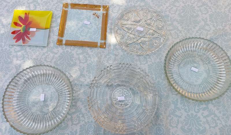AN ENTIRE COLLECTION OF GLASS SERVING PLATTERS