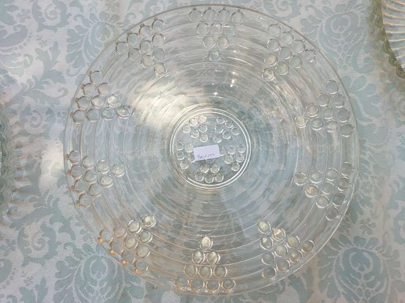 AN ENTIRE COLLECTION OF GLASS SERVING PLATTERS