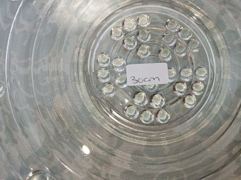AN ENTIRE COLLECTION OF GLASS SERVING PLATTERS