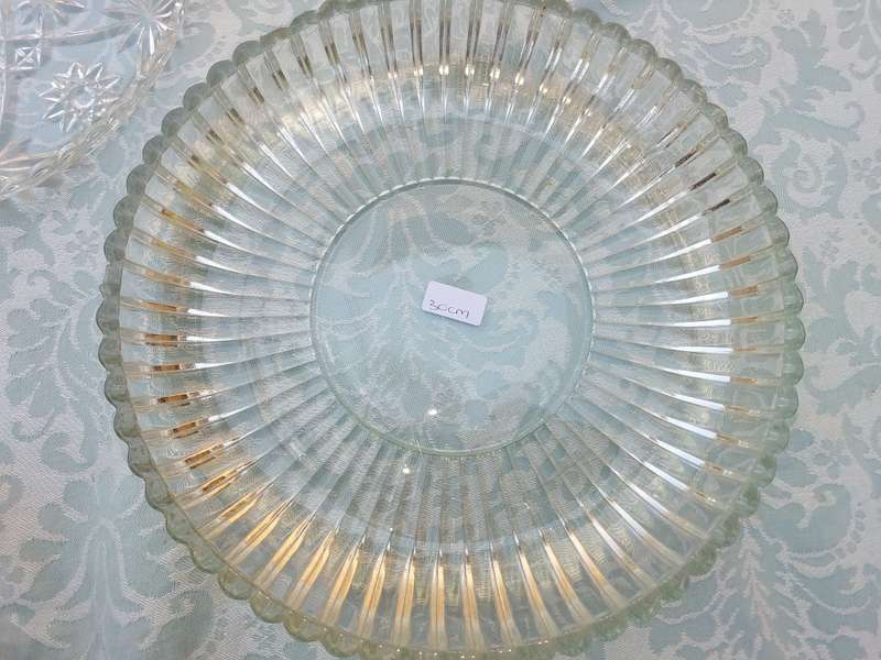 AN ENTIRE COLLECTION OF GLASS SERVING PLATTERS