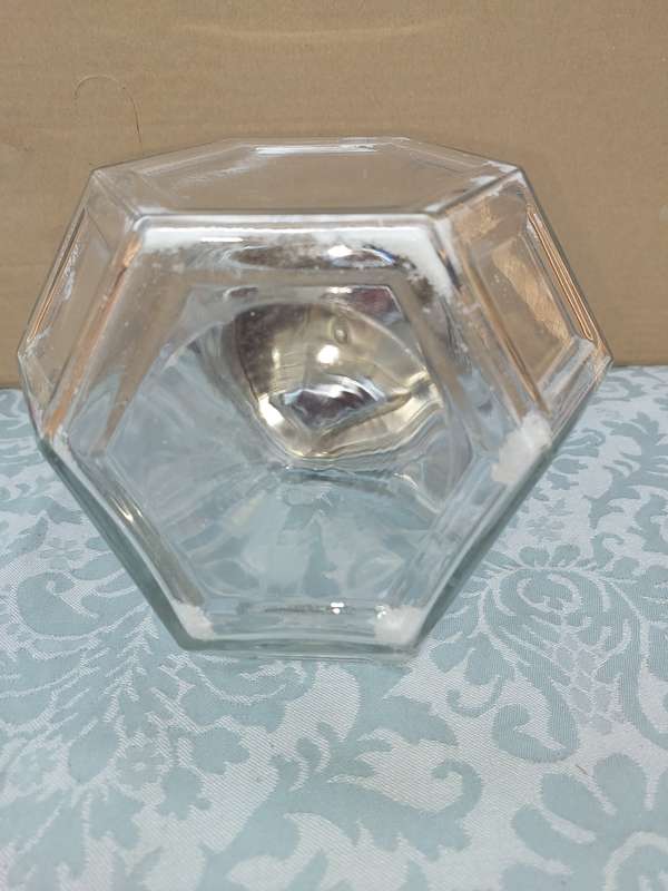A GLASS SWEAT JAR WITH A STAINLESS STEEL LID SOLD AS IS