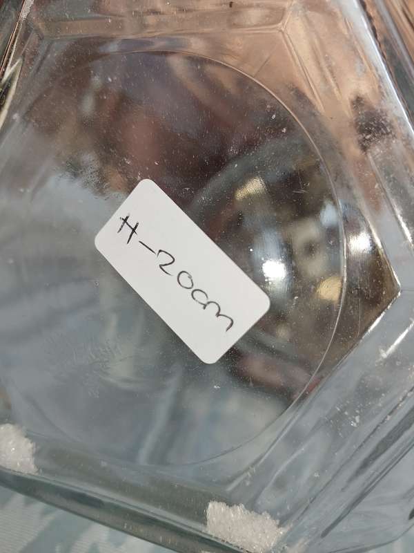 A GLASS SWEAT JAR WITH A STAINLESS STEEL LID SOLD AS IS