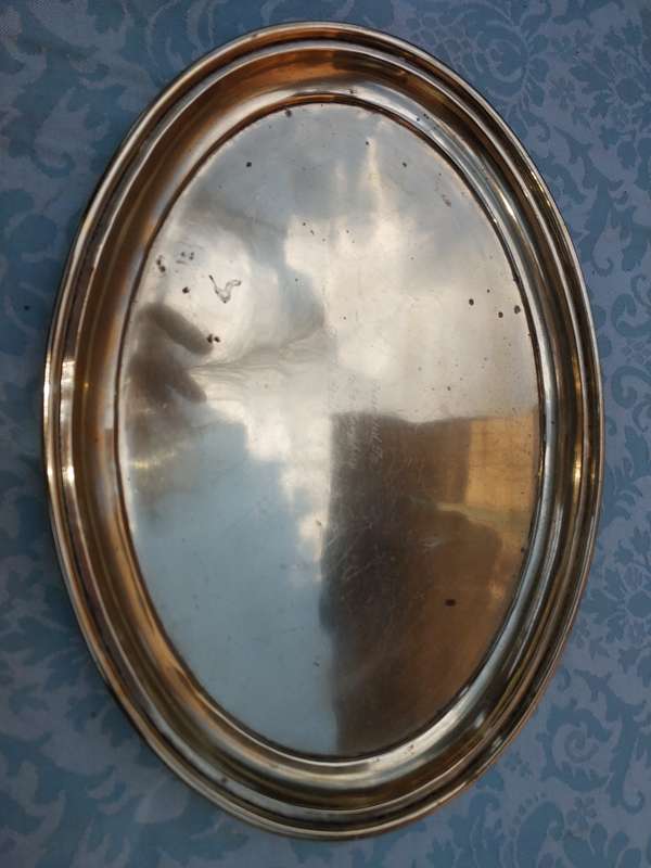 A SILVER-PLATED ON BRASS PLAQUE WITH ENGRAVINGS ON IT SOLD AS IS