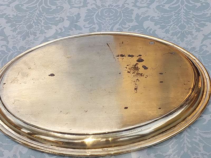 A SILVER-PLATED ON BRASS PLAQUE WITH ENGRAVINGS ON IT SOLD AS IS