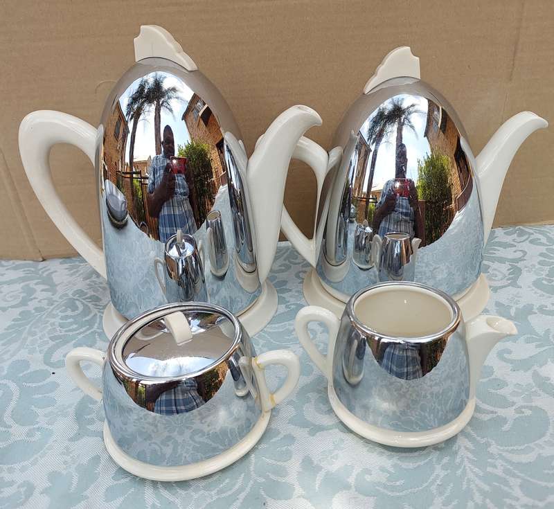AN ANTIQUE TEA JUG SET MADE IN ENGLAND CERAMIC WITH SILVER PLATED COVERS SOLD AS