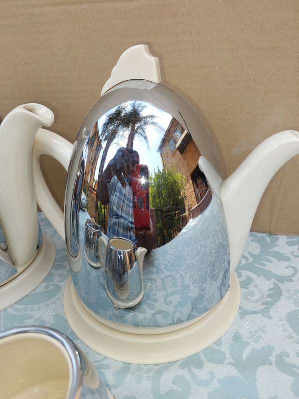 AN ANTIQUE TEA JUG SET MADE IN ENGLAND CERAMIC WITH SILVER PLATED COVERS SOLD AS