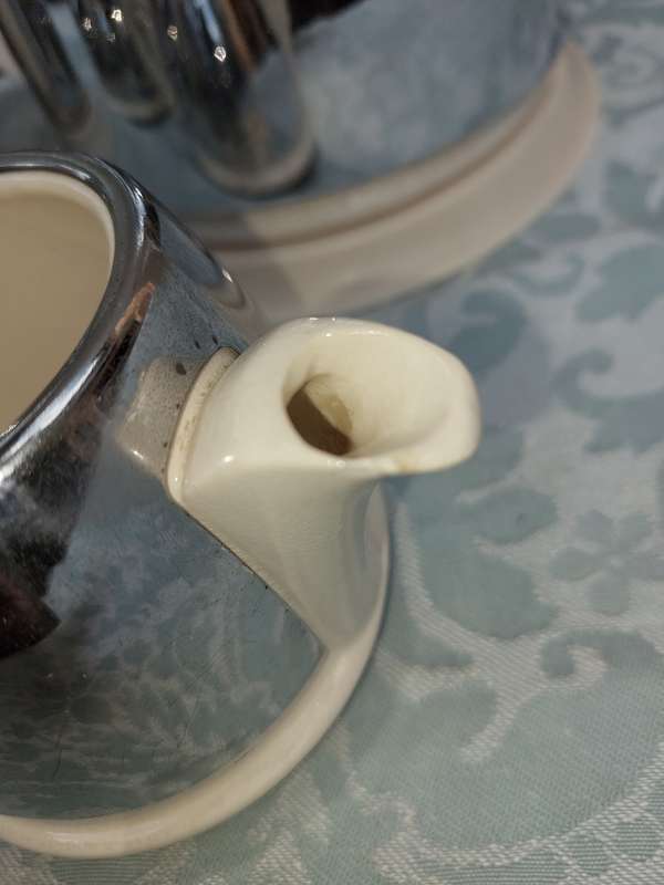 AN ANTIQUE TEA JUG SET MADE IN ENGLAND CERAMIC WITH SILVER PLATED COVERS SOLD AS