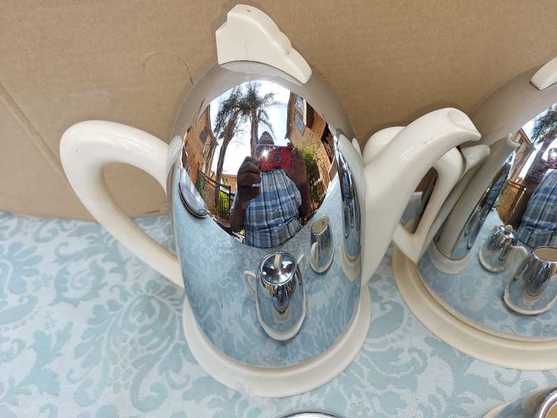 AN ANTIQUE TEA JUG SET MADE IN ENGLAND CERAMIC WITH SILVER PLATED COVERS SOLD AS
