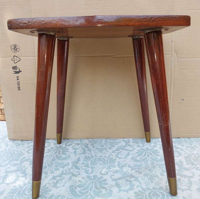 A VINTAGE DANISH-STYLE WOODEN SIDE TABLE WITH BRASS FOOTED LEGS
