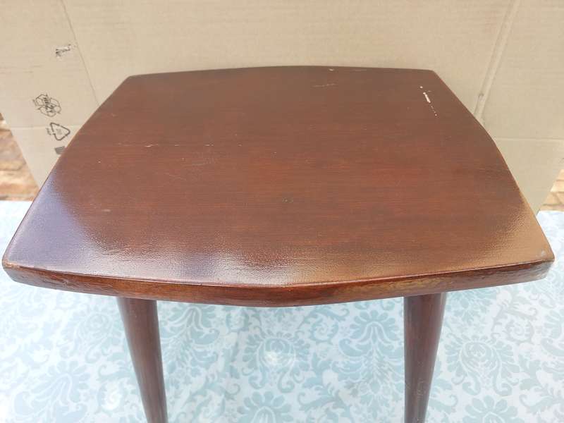 A VINTAGE DANISH-STYLE WOODEN SIDE TABLE WITH BRASS FOOTED LEGS