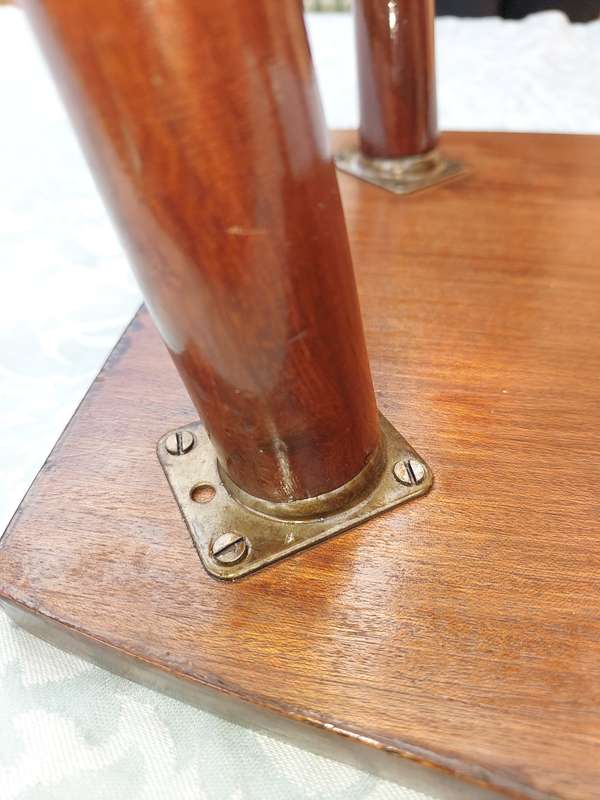 A VINTAGE DANISH-STYLE WOODEN SIDE TABLE WITH BRASS FOOTED LEGS