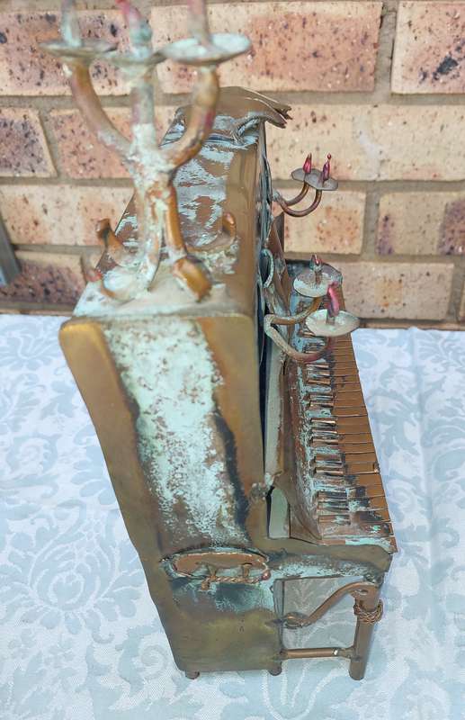 A COLLECTION OF COPPER FIGURINE ART SCULPTURES A PIANIST ,A PIANO WITH A SAXOPHONIST AND A BICYCLE