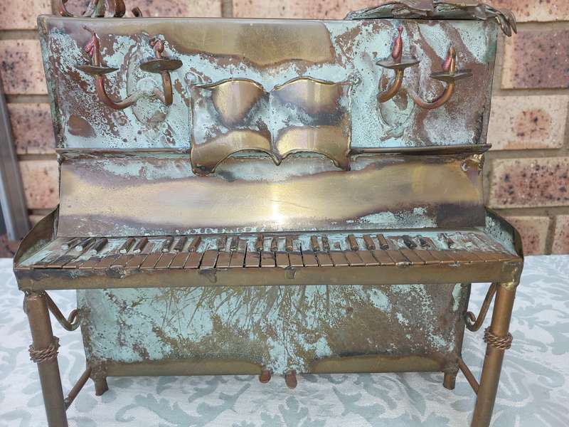 A COLLECTION OF COPPER FIGURINE ART SCULPTURES A PIANIST ,A PIANO WITH A SAXOPHONIST AND A BICYCLE