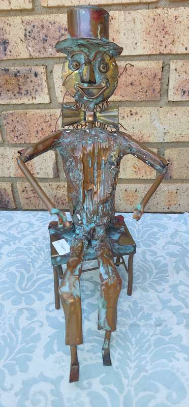 A COLLECTION OF COPPER FIGURINE ART SCULPTURES A PIANIST ,A PIANO WITH A SAXOPHONIST AND A BICYCLE