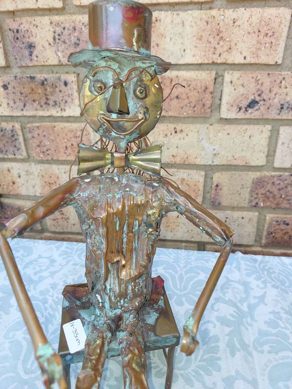 A COLLECTION OF COPPER FIGURINE ART SCULPTURES A PIANIST ,A PIANO WITH A SAXOPHONIST AND A BICYCLE