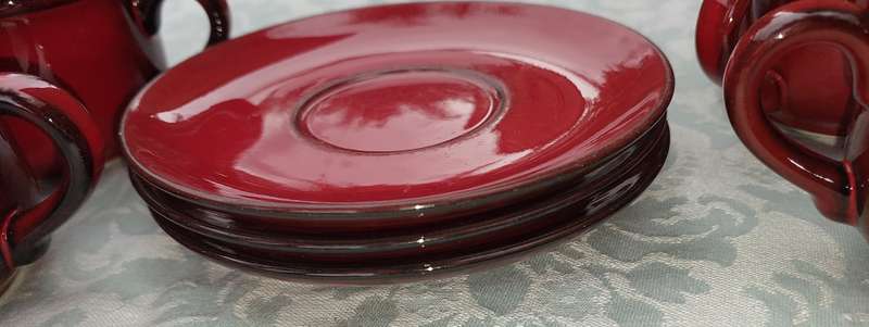 A COLLECTION OF 4 CUPS AND THREE SUCERS BY VILLEROY &BOCH CARDOBA MADE IN LUXEMBERG RED SOLD AS IS