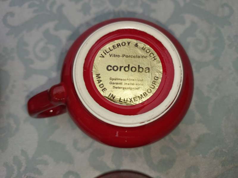 A COLLECTION OF 4 CUPS AND THREE SUCERS BY VILLEROY &BOCH CARDOBA MADE IN LUXEMBERG RED SOLD AS IS