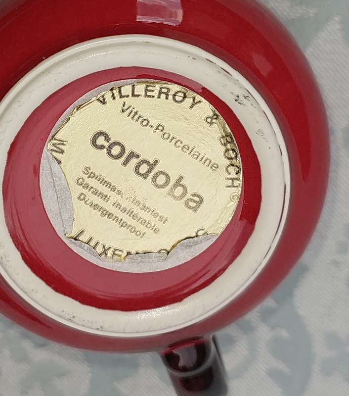 A COLLECTION OF 4 CUPS AND THREE SUCERS BY VILLEROY &BOCH CARDOBA MADE IN LUXEMBERG RED SOLD AS IS