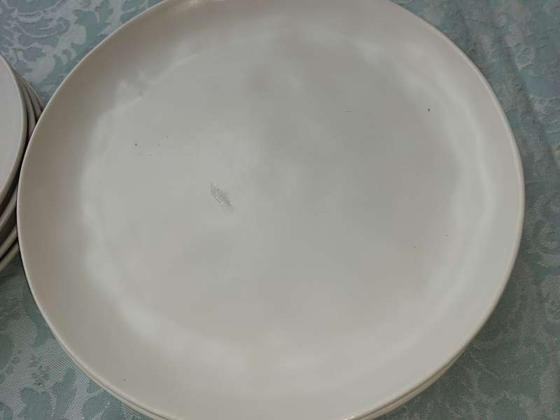 A 12 PIECE CERAMIC DINNER SET OFF WHITE IN COLOUR SOLD AS IS