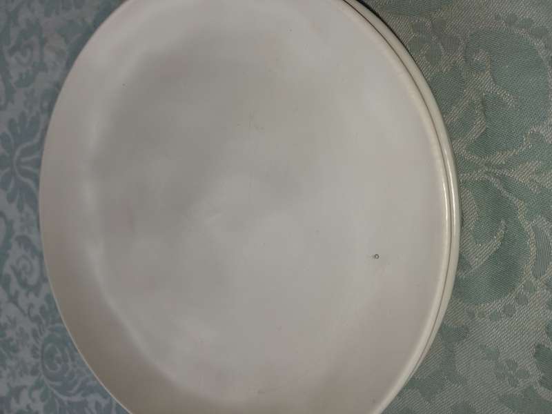 A 12 PIECE CERAMIC DINNER SET OFF WHITE IN COLOUR SOLD AS IS