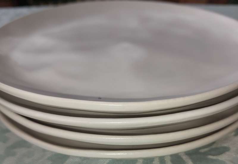 A 12 PIECE CERAMIC DINNER SET OFF WHITE IN COLOUR SOLD AS IS