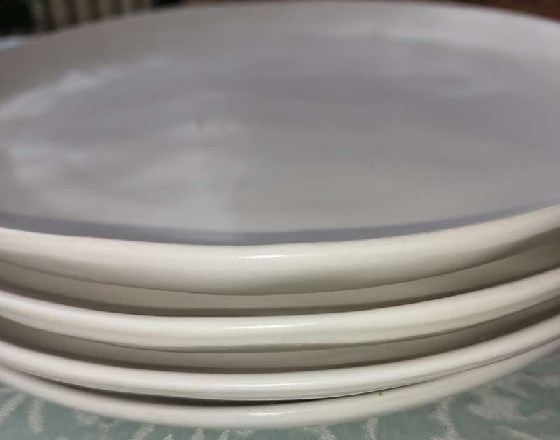 A 12 PIECE CERAMIC DINNER SET OFF WHITE IN COLOUR SOLD AS IS