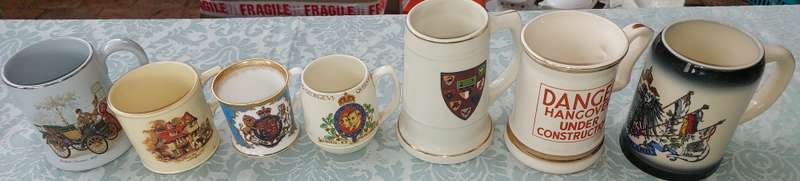 A COLLECTION OF VINTAGE AND ANTIQUE MUGS AND BEER MUGS SOLD AS IS