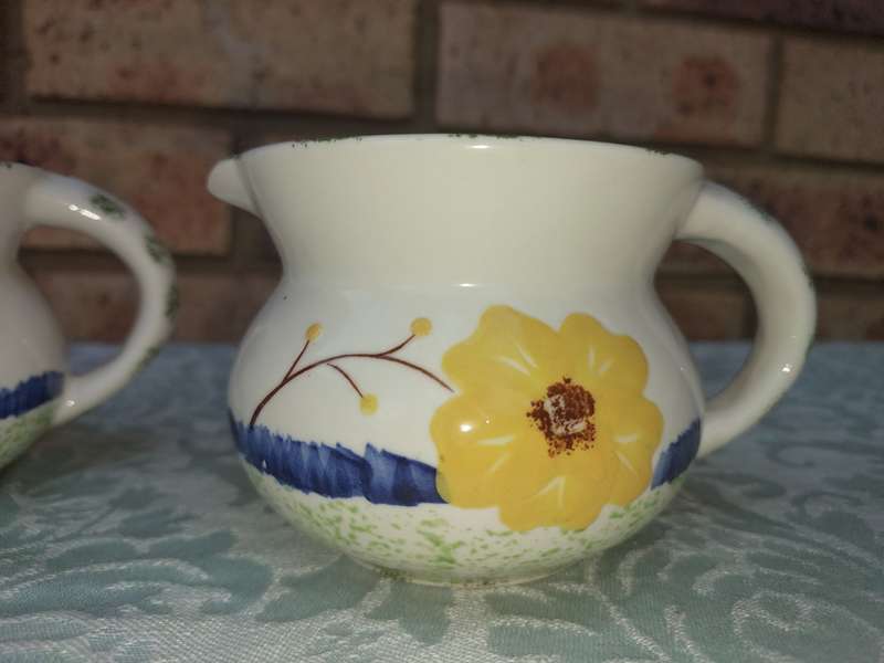 A COLLECTION OF 3 VINTAGE PORCELAIN JUGS SOLD AS IS