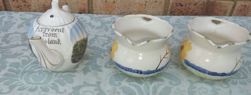 A COLLECTION OF 3 VINTAGE PORCELAIN JUGS SOLD AS IS