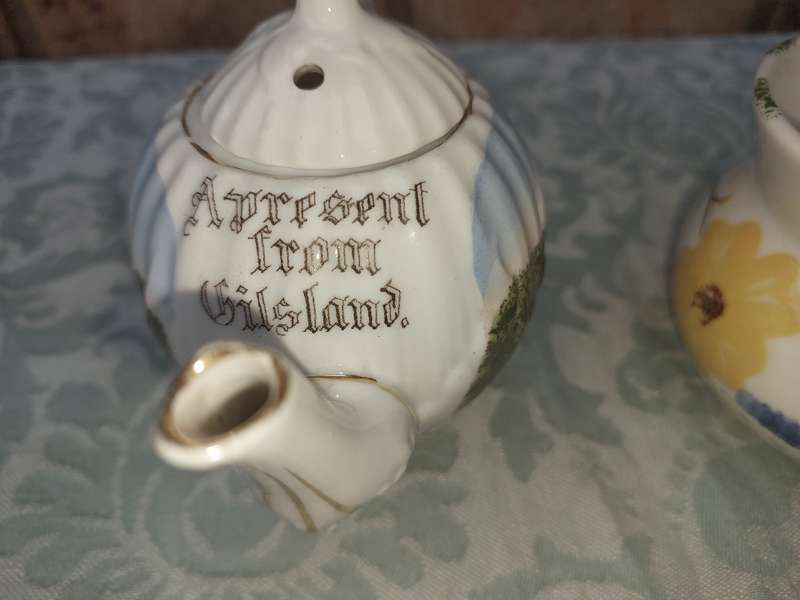 A COLLECTION OF 3 VINTAGE PORCELAIN JUGS SOLD AS IS