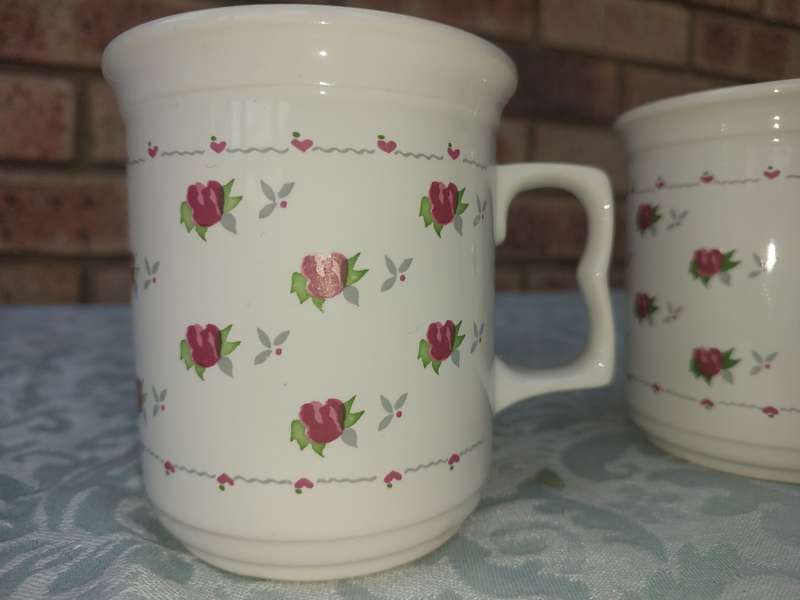 TWO COFFE CUPS PORCELAIN SOLD AS IS