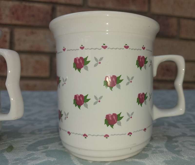 TWO COFFE CUPS PORCELAIN SOLD AS IS