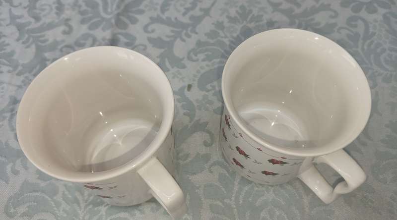 TWO COFFE CUPS PORCELAIN SOLD AS IS
