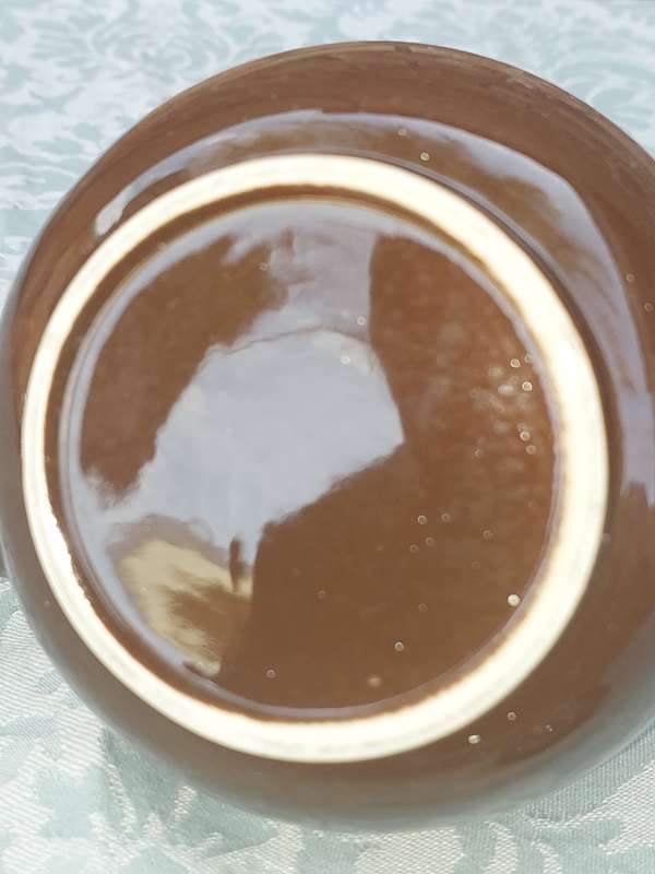 A vintage ceramic brown teapot sold as is