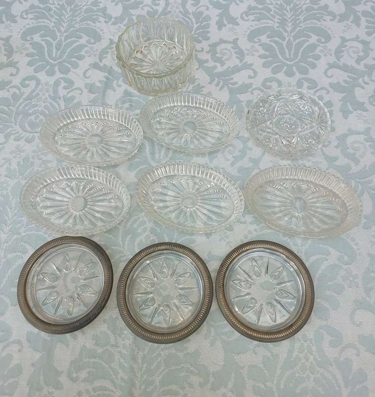 A COLLECTION OF COASTER WITH SILVER PLATED RIMS AND ORNATE CONDIMENTS OVAL MINIATURE PLATTERS