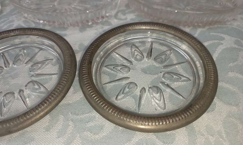 A COLLECTION OF COASTER WITH SILVER PLATED RIMS AND ORNATE CONDIMENTS OVAL MINIATURE PLATTERS