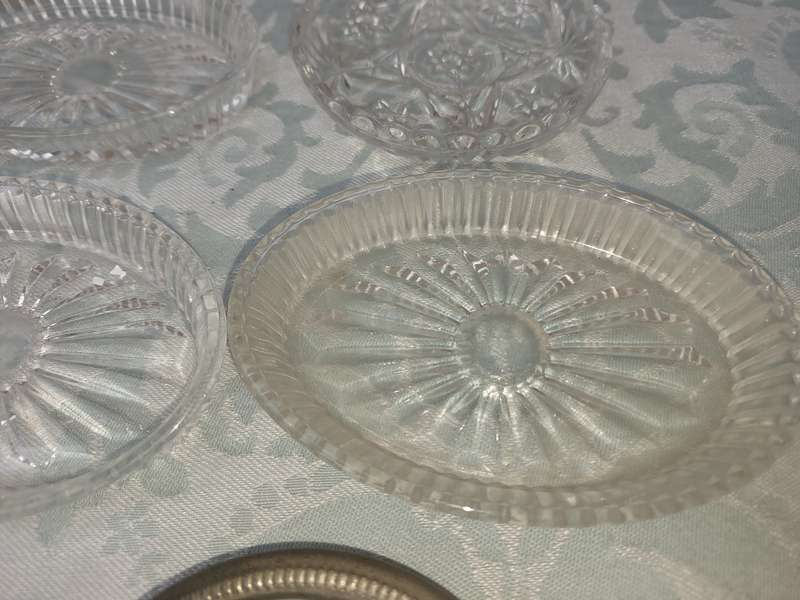 A COLLECTION OF COASTER WITH SILVER PLATED RIMS AND ORNATE CONDIMENTS OVAL MINIATURE PLATTERS