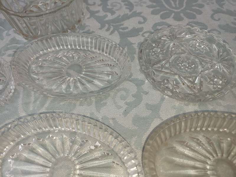 A COLLECTION OF COASTER WITH SILVER PLATED RIMS AND ORNATE CONDIMENTS OVAL MINIATURE PLATTERS