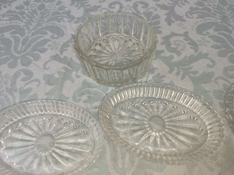 A COLLECTION OF COASTER WITH SILVER PLATED RIMS AND ORNATE CONDIMENTS OVAL MINIATURE PLATTERS