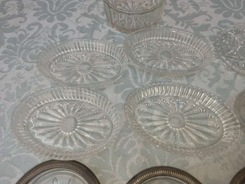 A COLLECTION OF COASTER WITH SILVER PLATED RIMS AND ORNATE CONDIMENTS OVAL MINIATURE PLATTERS