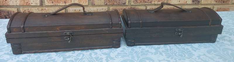 TWO ORNATE WOODEN WINE CADDYS WITH LEATHER HANDLES