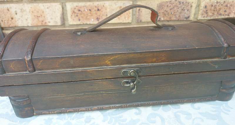 TWO ORNATE WOODEN WINE CADDYS WITH LEATHER HANDLES