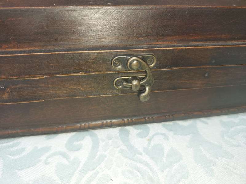 TWO ORNATE WOODEN WINE CADDYS WITH LEATHER HANDLES