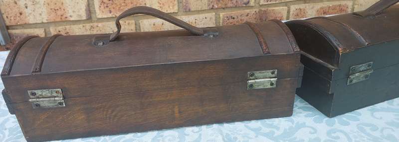 TWO ORNATE WOODEN WINE CADDYS WITH LEATHER HANDLES