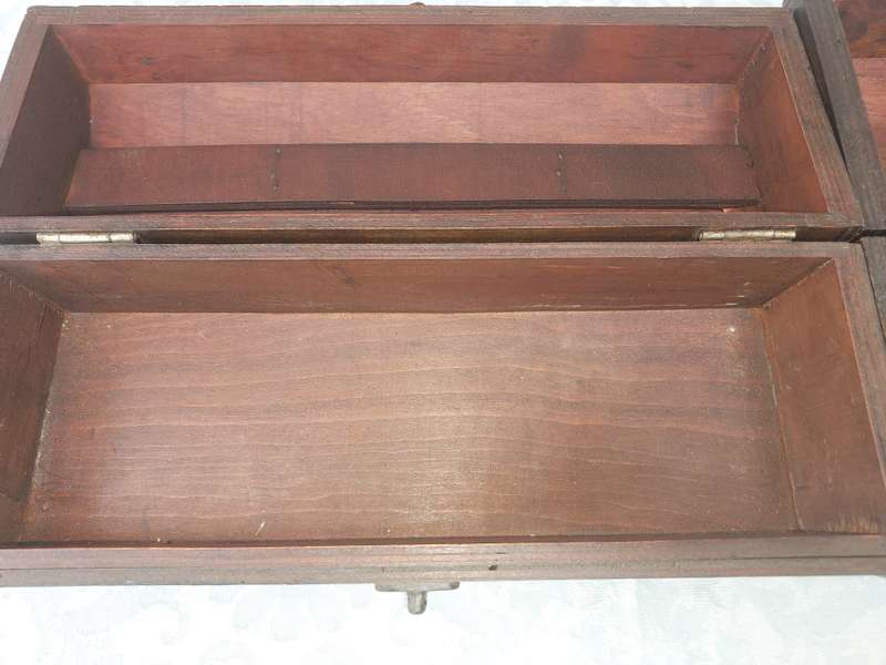 TWO ORNATE WOODEN WINE CADDYS WITH LEATHER HANDLES